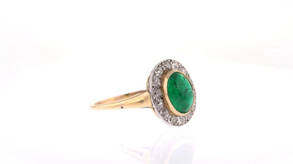 Cabochon Emerald Ring With Striking White Diamond Surround